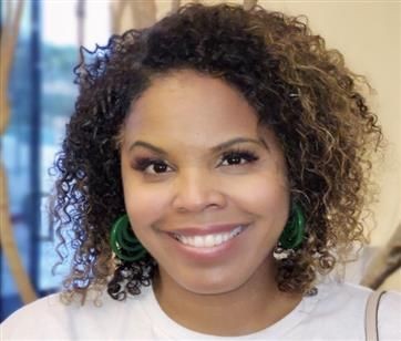 Woman with curly hair smiling